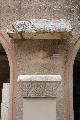 Marble capital decorated with Jewish menorahs. Above it a marble cornice bearing the inscription SYNA]GOGE OF THE HEBR[WS