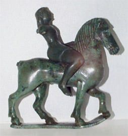 The young rider wears a short chiton and his bronze horse is depicted in an easy trot.