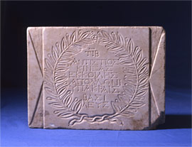 Marble votiv stele to Apollon Hypakraios