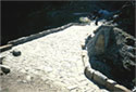 The paved surface of the bridge and the parapet