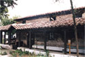 View of the Church of Agios Nikolaos from the southeast: the enclosed balcony with its exterior wall paintings