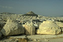 View of ancient temple remains. At the background, Lycabetus hill is sighted