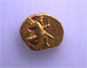 Golden coin of Azoros with representation o f a man with bow