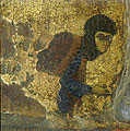 Femal figure, probably the woman offering the icon, kneeling and praying