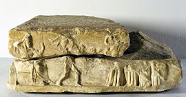 View of the Polydamas statue base with the relief representation. In the picture, king Darios and four women are watching Polydamas defeating one of his opponents.