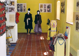 At the back of the hall, the two traditional dresses.
