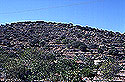 View of the hill with the ancient wall