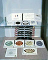 Showcase with models and trial prints of stamps